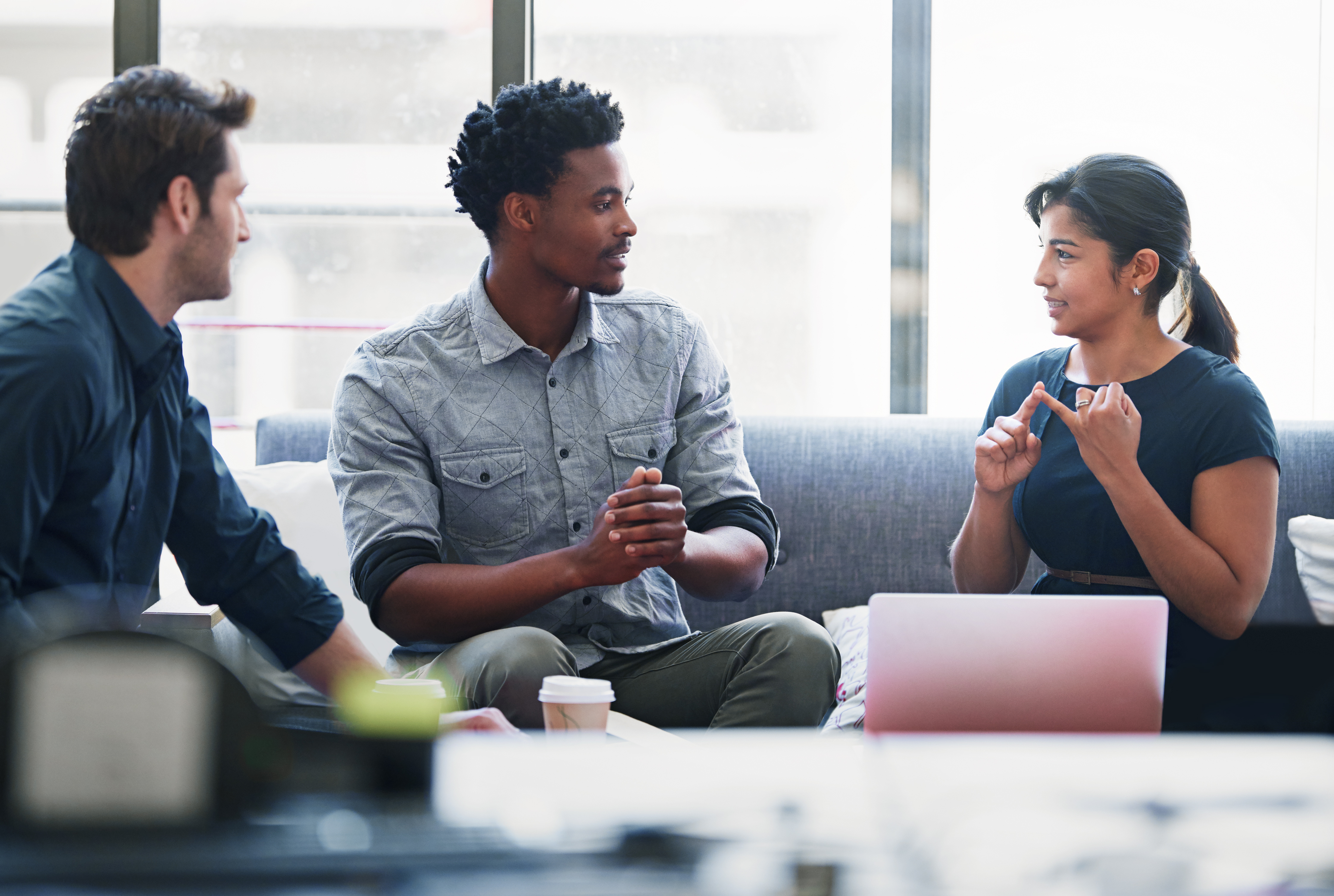 Diverse employees having a discussion