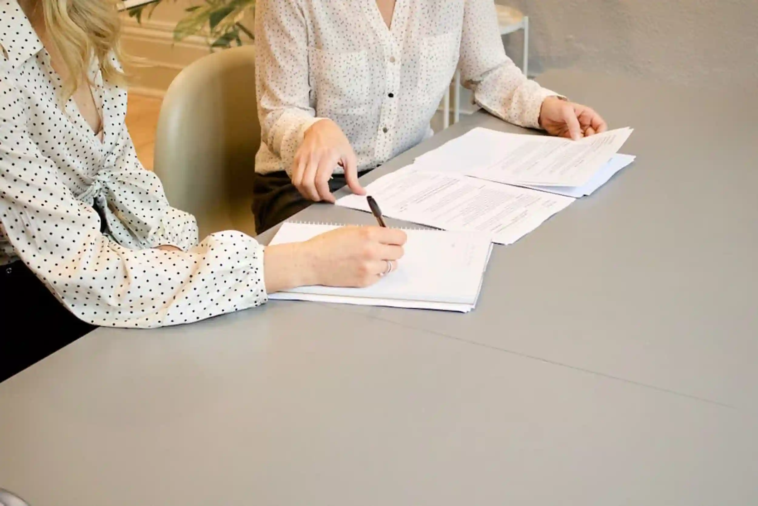 Two employees reading over the Work Life Balance and Miscellaneous Provisions Act 2023