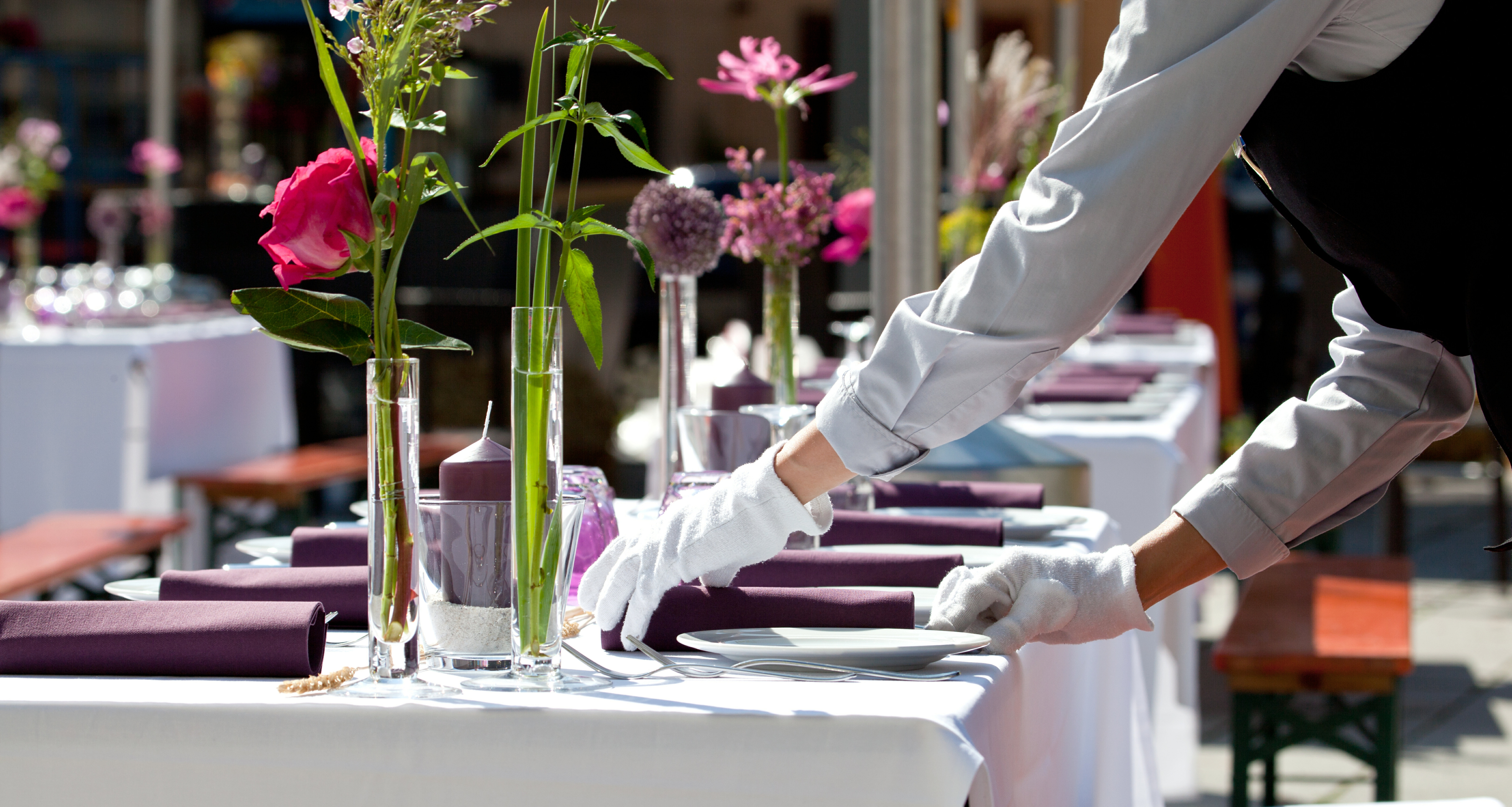 Waiter setting a table